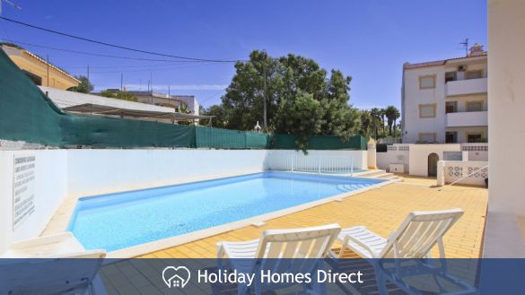 Pleasant communal swimming pool at the rear.